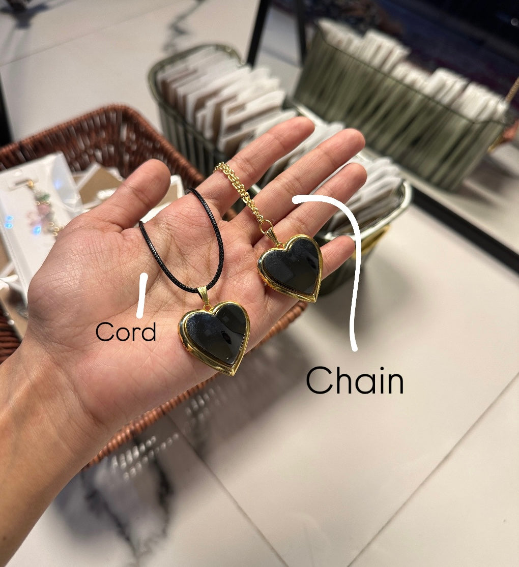 Openable mirror heart locket