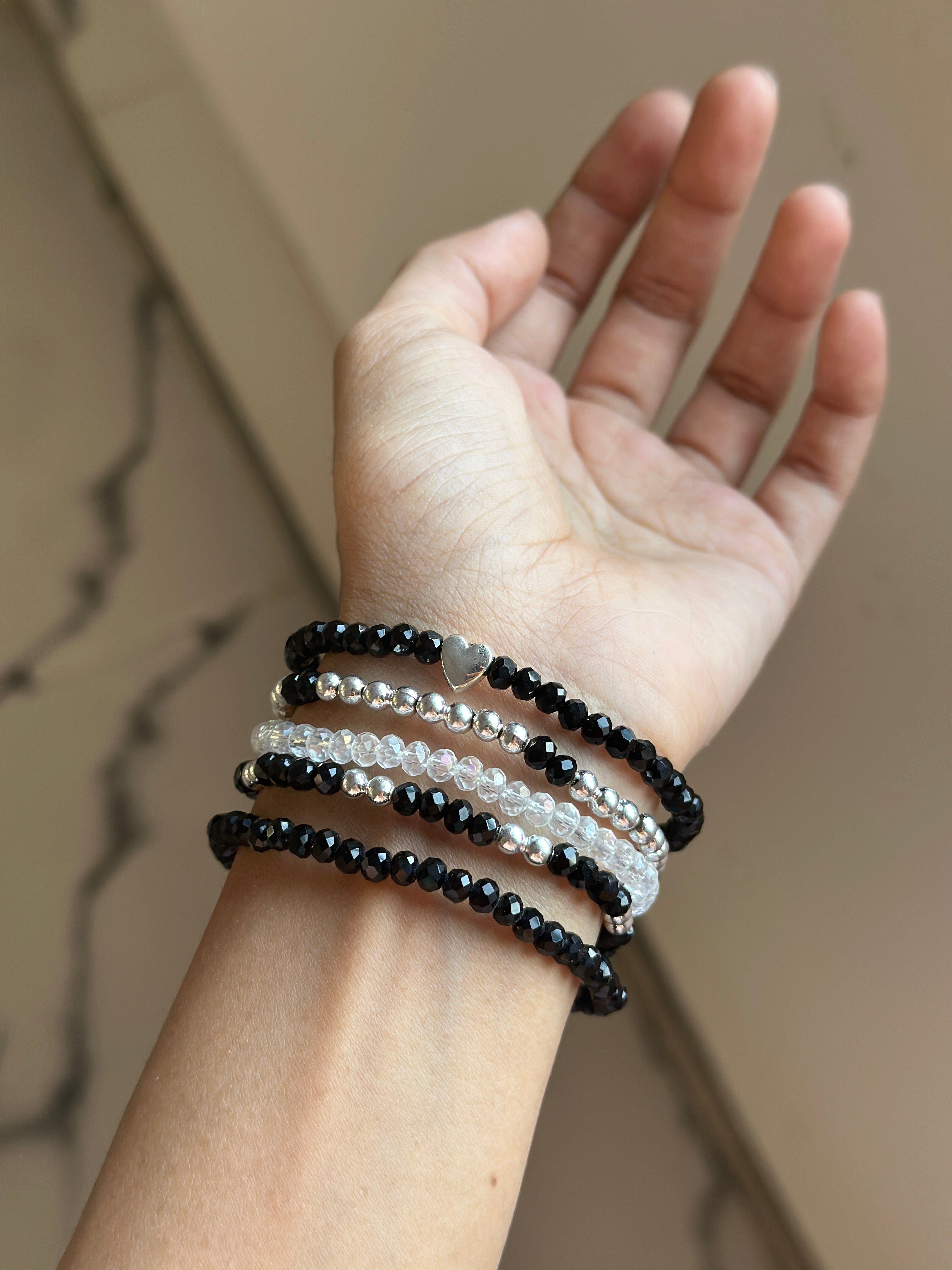 Black bracelet stack (p5)