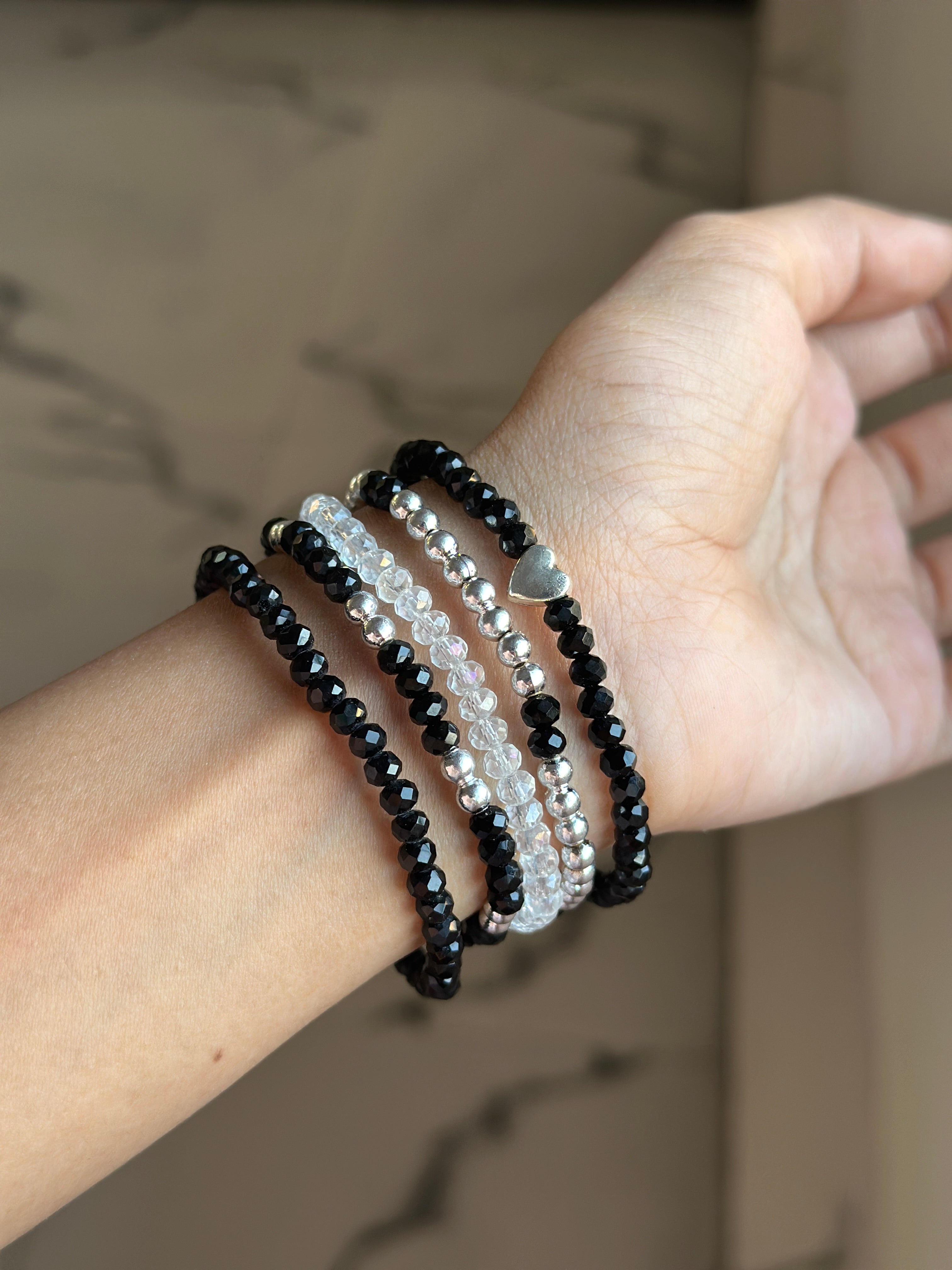 Black bracelet stack (p5)