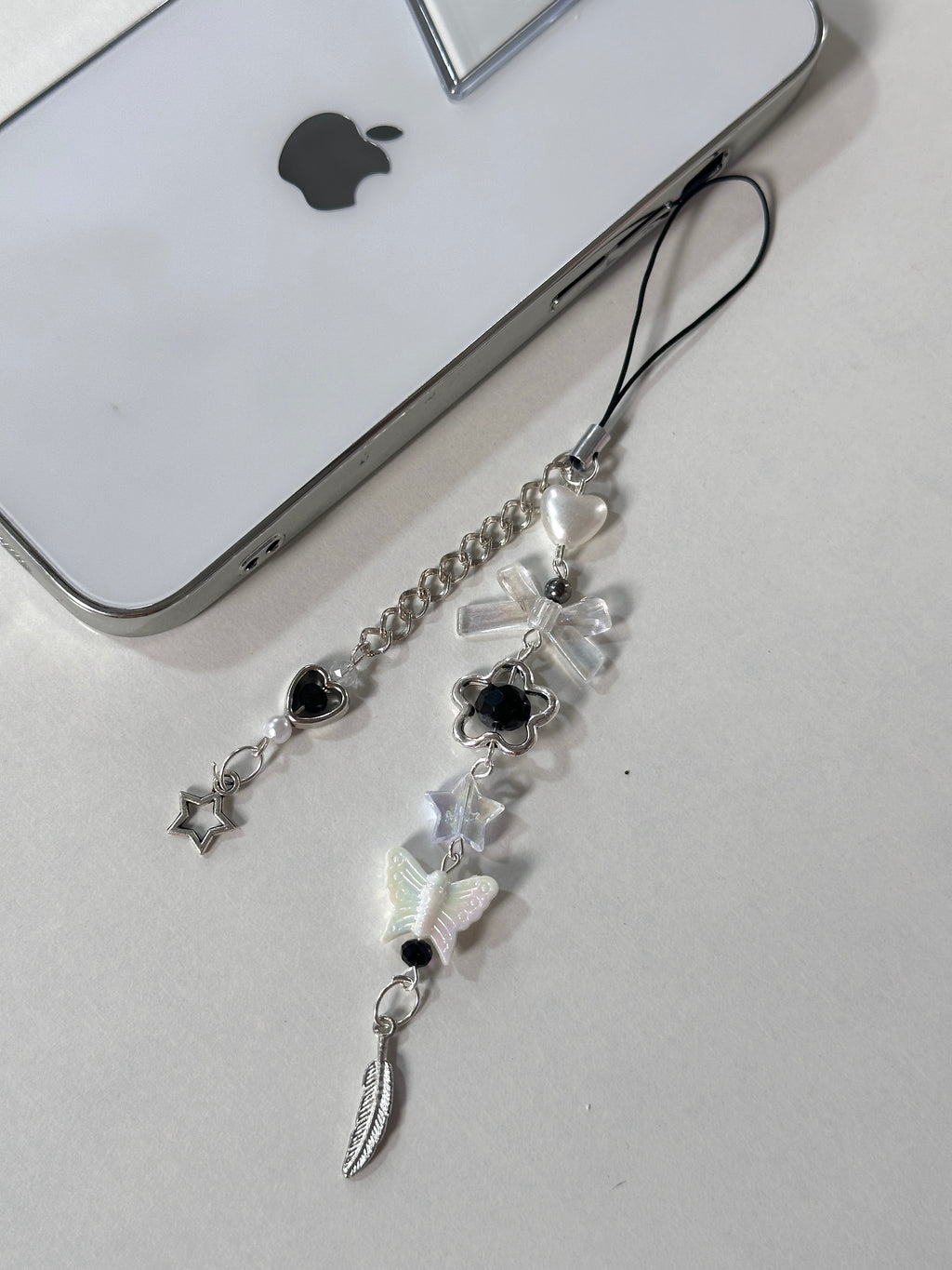 Feather phone charm
