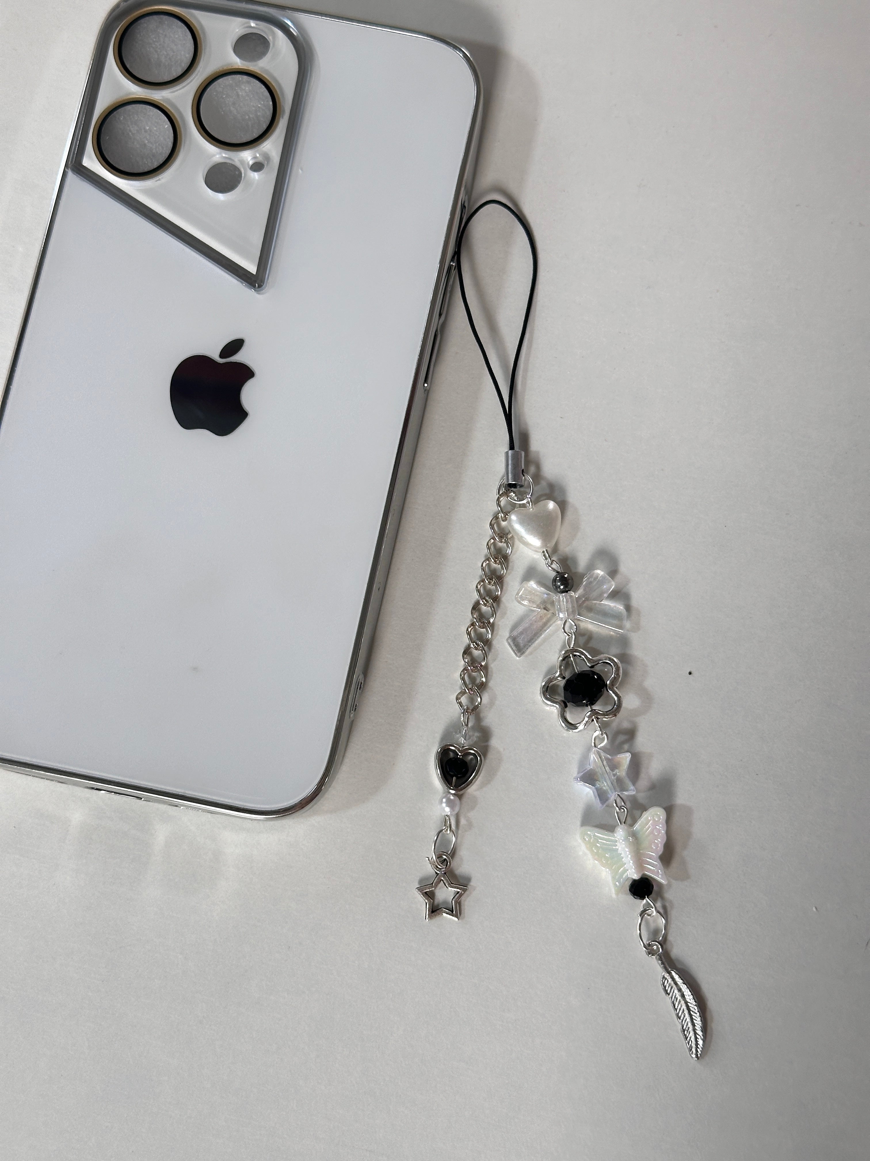 Feather phone charm